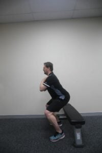 How to do a chair squat / box squat - step 2 side view